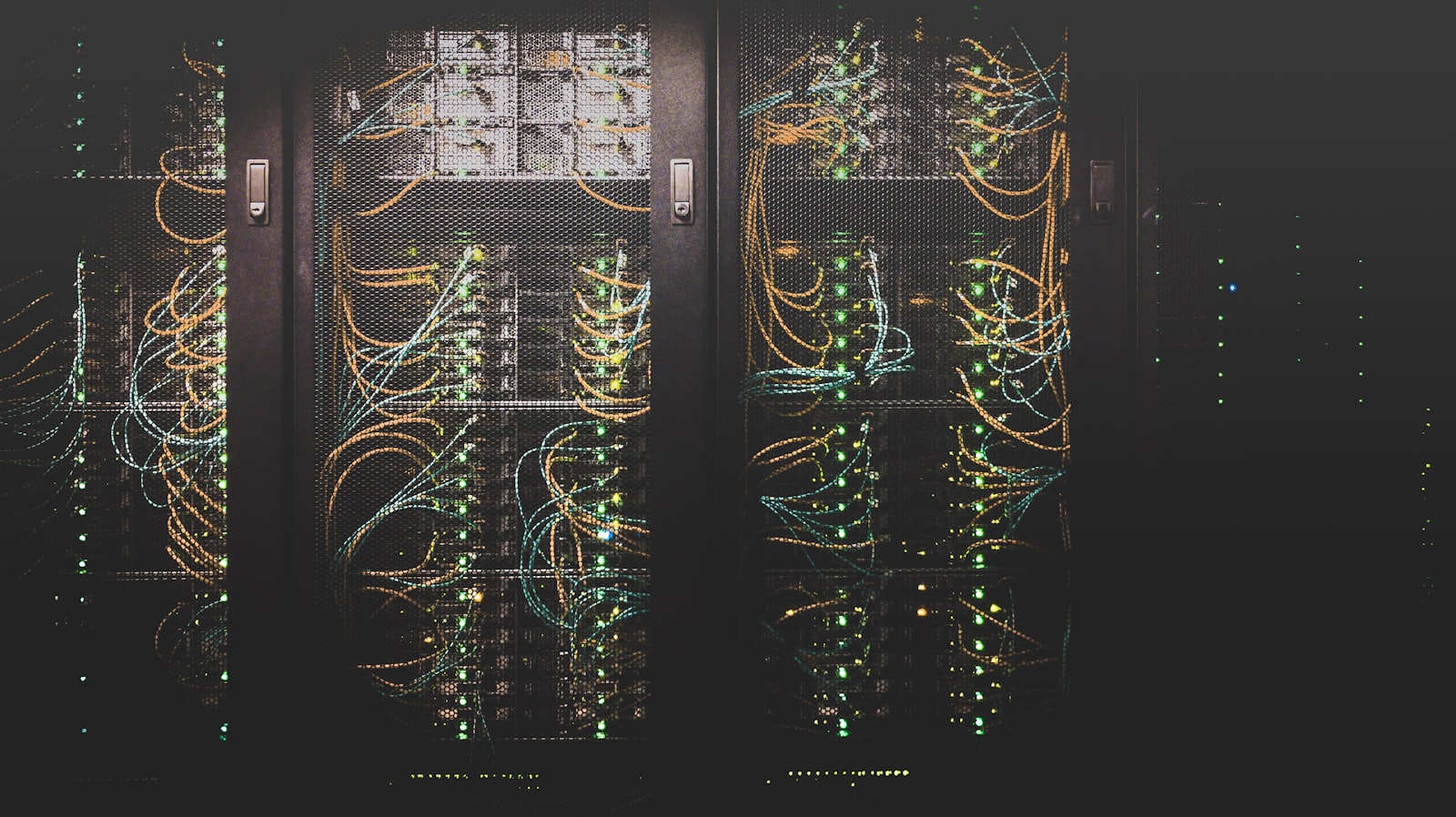 Rows of illuminated servers in a modern data centre